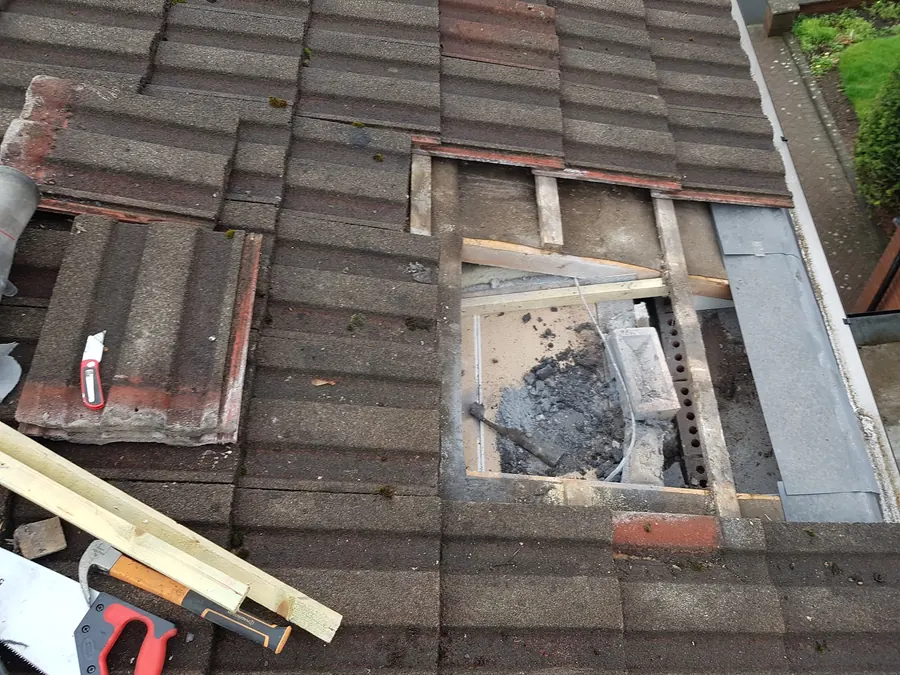 Broken tiles leaving a hole in the roof, before repair, Dawn Roofs Ltd