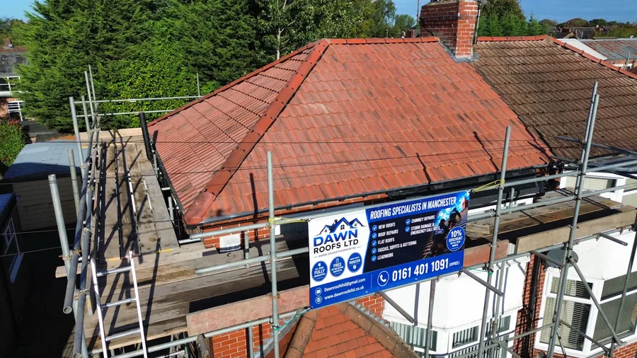Drone view of a red tile bungalow re-roof with the Dawn Roofs banner, Dawn Roofs Ltd