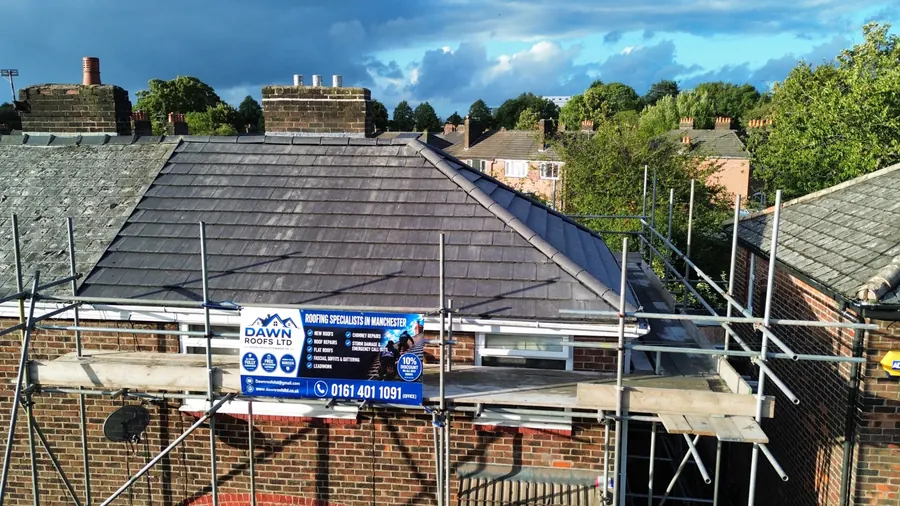 Drone view of a slate bungalow re-roof with the Dawn Roofs banner, Dawn Roofs Ltd