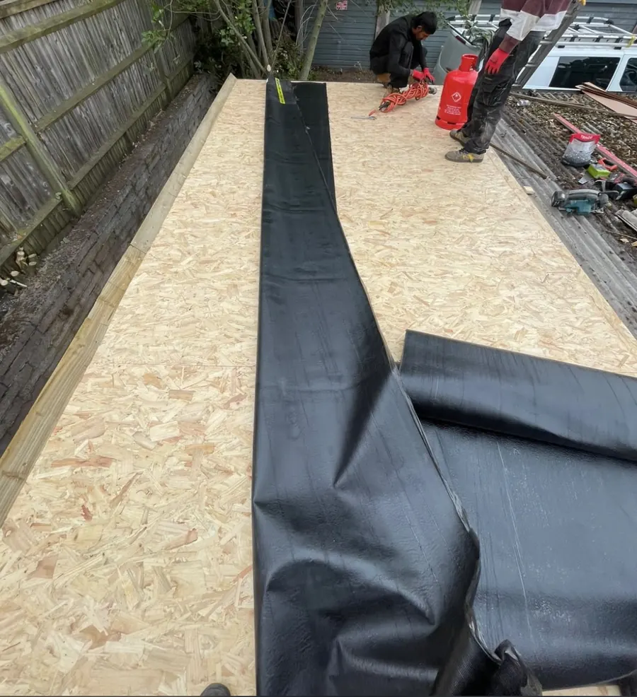 EPDM rubber being laid over a new timber deck, Dawn Roofs Ltd