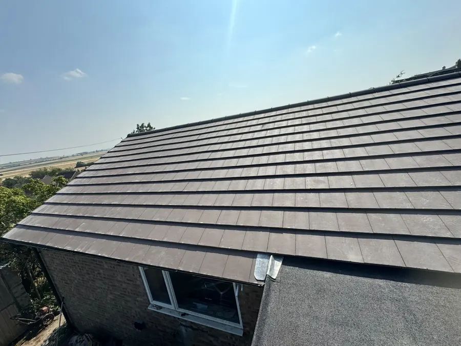 Grey tile roof finished on a detached bungalow, Dawn Roofs Ltd