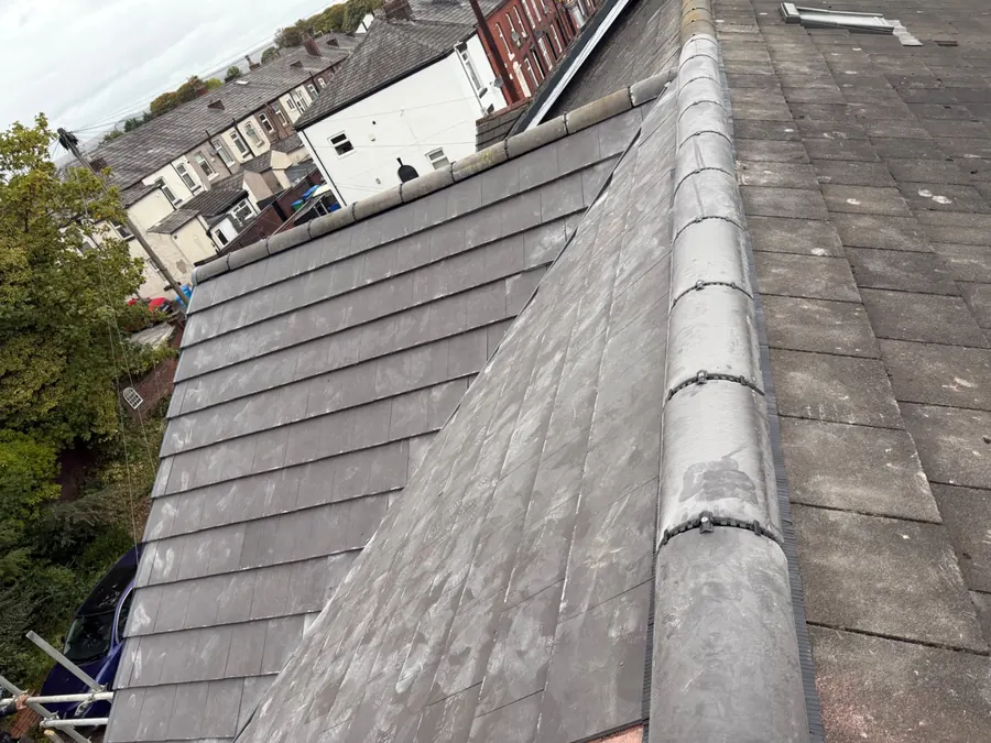 Grey concrete tile roof with a new ridge line, Dawn Roofs Ltd