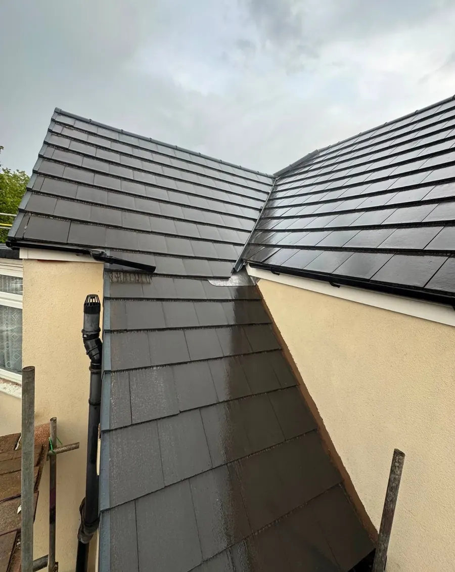 Grey tile valley where two roofs meet, Dawn Roofs Ltd