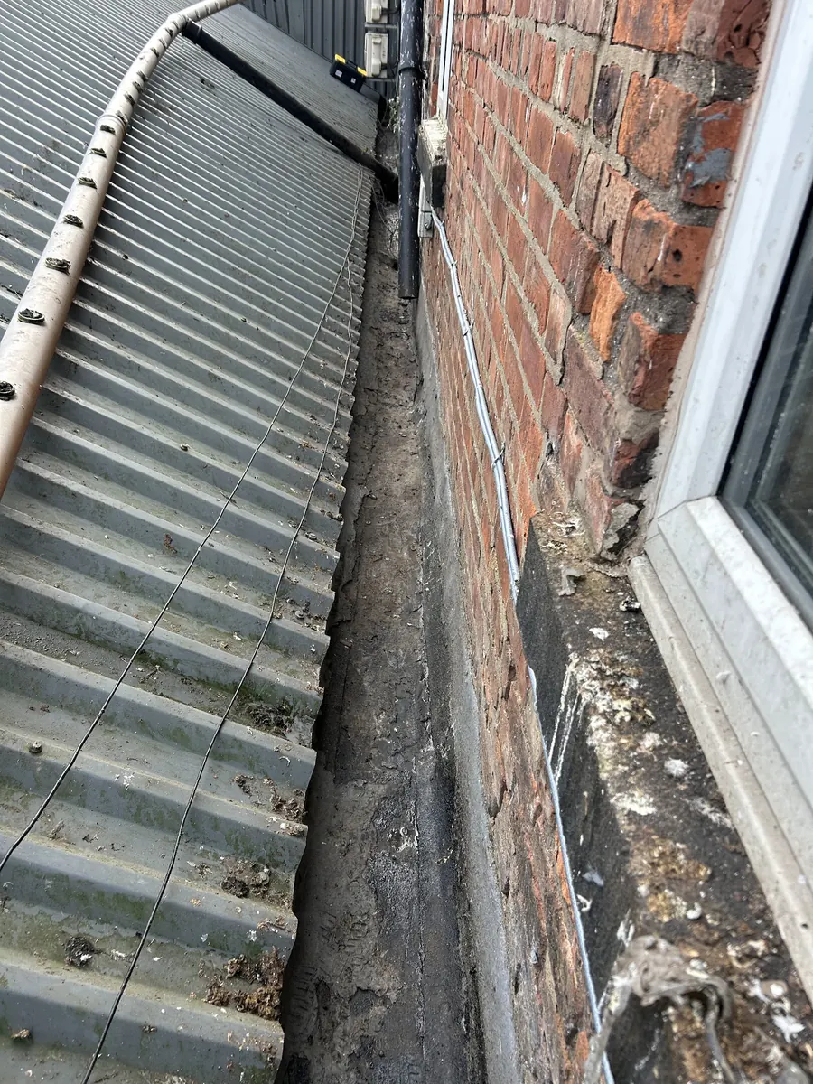 Blocked gutter before clearing, Dawn Roofs Ltd