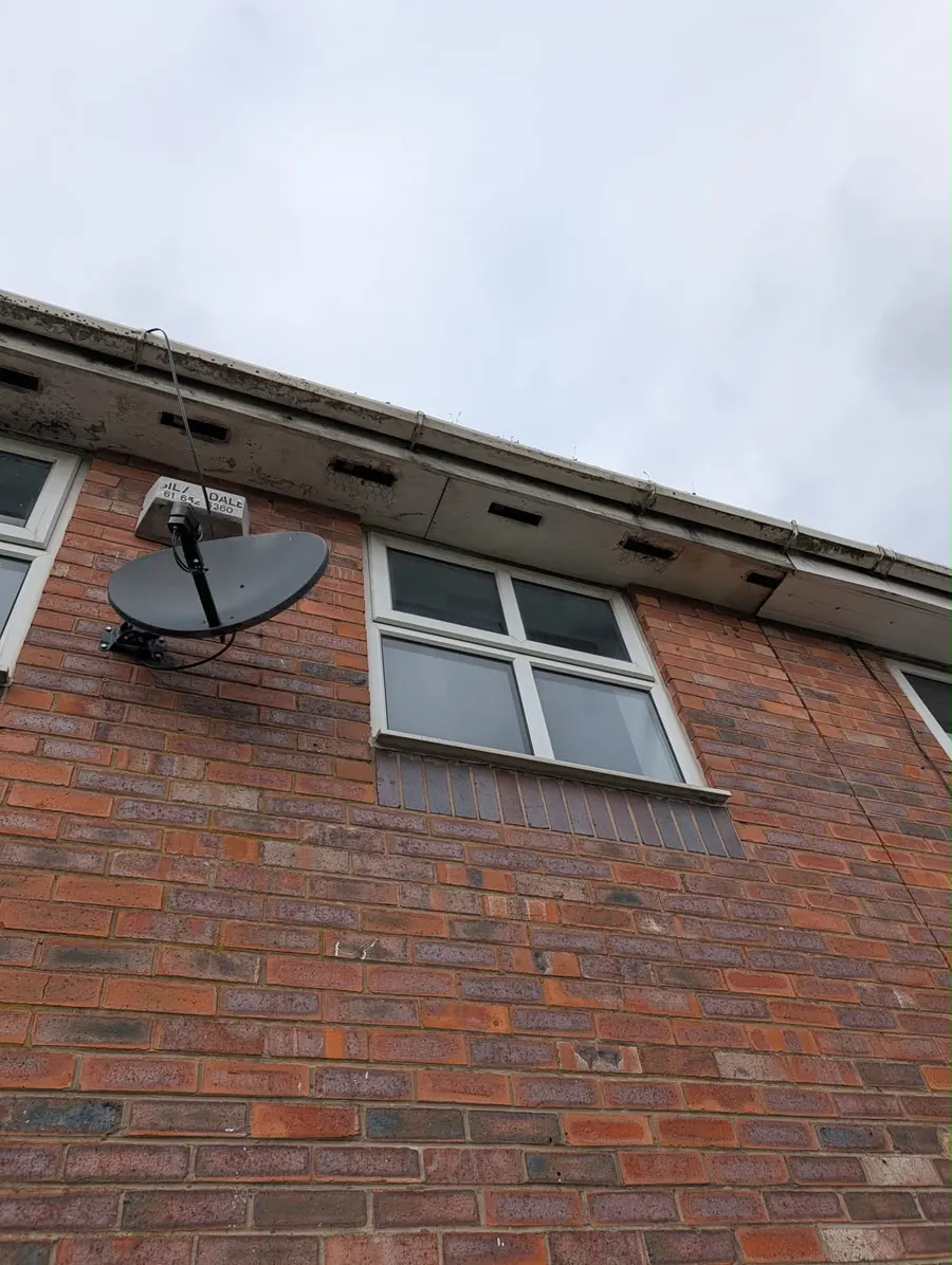 New white fascia and gutter on a brick house, Dawn Roofs Ltd