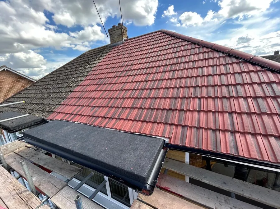 Red tile roof with a flat-roofed dormer, Dawn Roofs Ltd