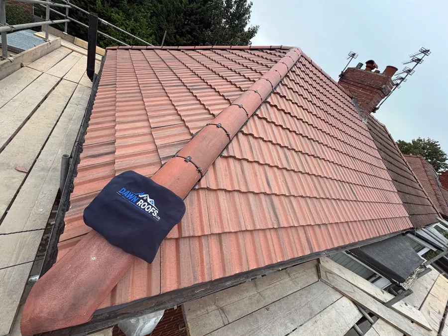 Finished red tile hip roof seen from the scaffold, Dawn Roofs Ltd