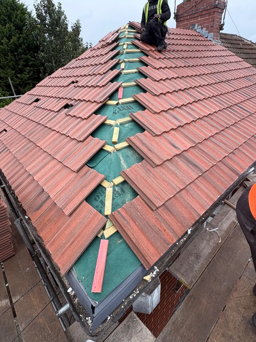 Hip being re-tiled over new membrane, Dawn Roofs Ltd
