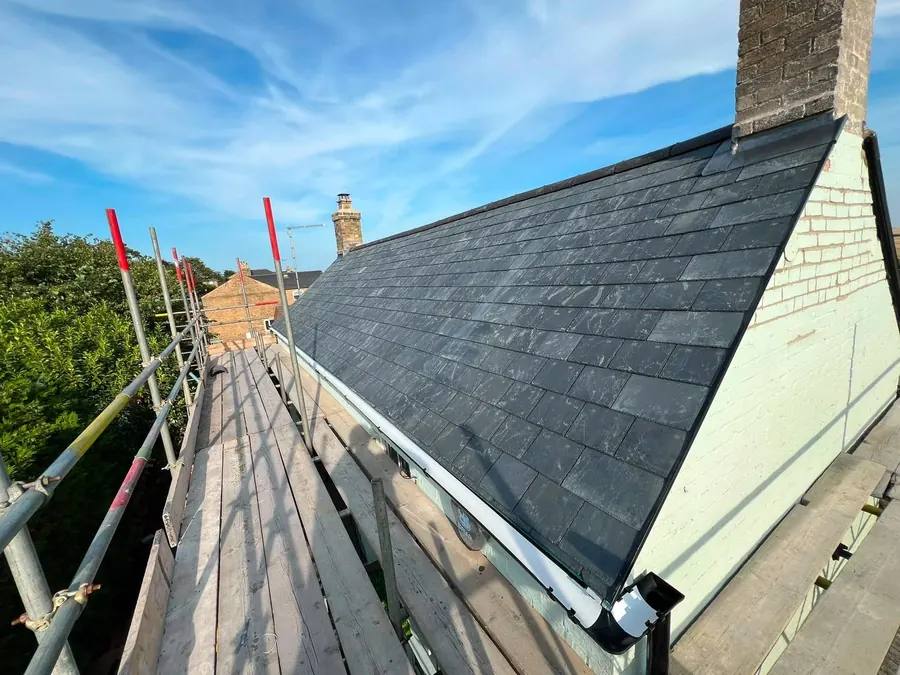 New slate slope at a gable, from the scaffold, Dawn Roofs Ltd