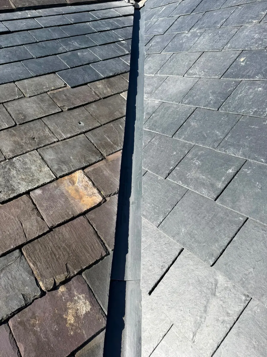 Slate roof with a lead flashing line, Dawn Roofs Ltd