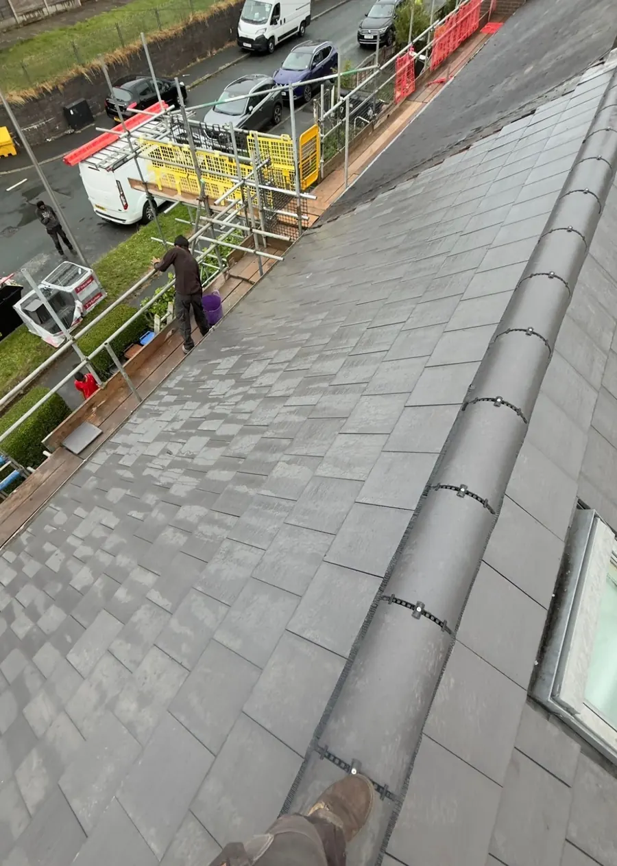 Slate roof with new ridge and roof window, Dawn Roofs Ltd