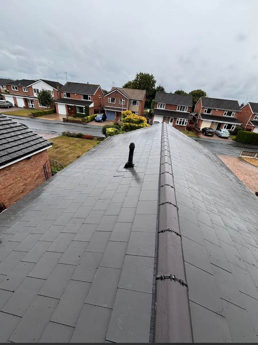 New slate ridge looking down the street, Dawn Roofs Ltd