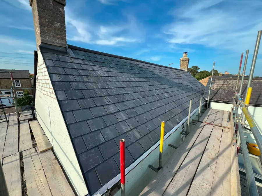 Slate roof finished between the chimney and the gable, Dawn Roofs Ltd