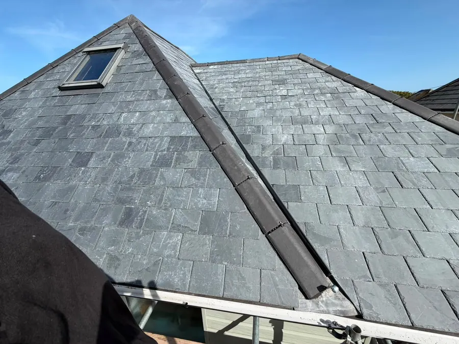 Slate roof with a roof window and new hip, Dawn Roofs Ltd