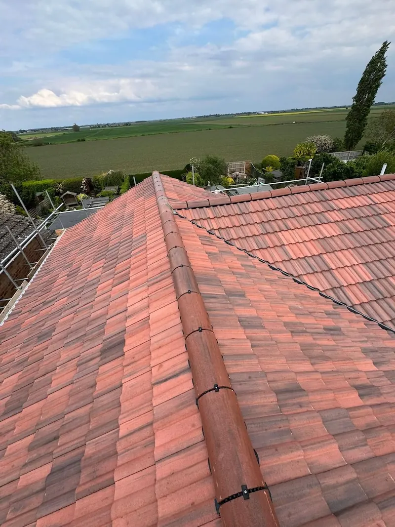 Finished red tile re-roof on the Urmston job, Dawn Roofs Ltd