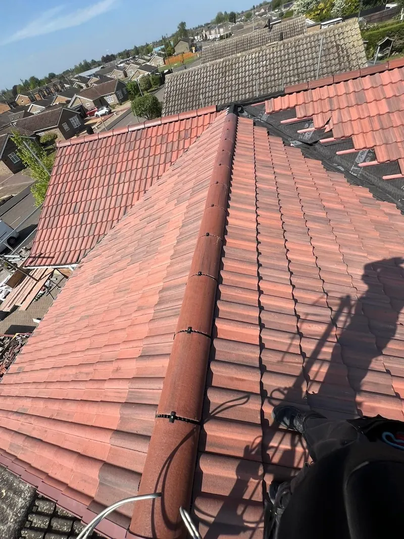 Red tile hip going on during the Urmston re-roof, Dawn Roofs Ltd